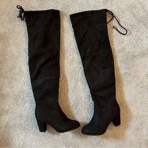 Black thigh high heeled boots